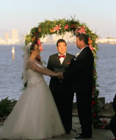 Isaac presiding over the wedding of Kerri Dopart & Travis Peterson. Photo by Dennis Andersen